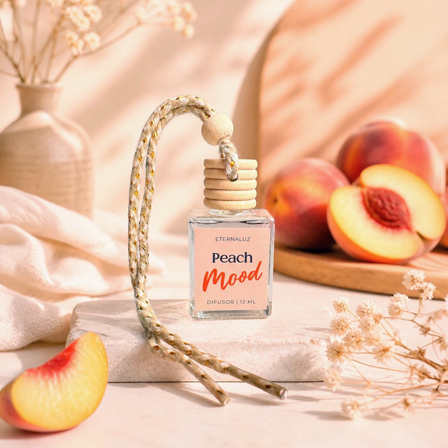 Difusor de Auto Eternaluz Peach Mood con aroma a durazno, naranja y vainilla.