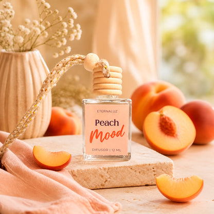 Difusor de Auto Eternaluz Peach Mood con aroma a durazno, naranja y vainilla.