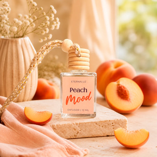 Difusor de Auto Eternaluz Peach Mood con aroma a durazno, naranja y vainilla.