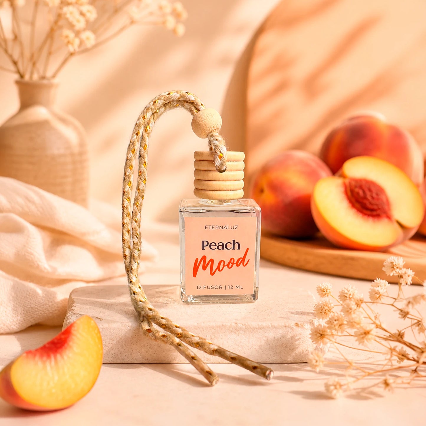 Difusor de Auto Eternaluz Peach Mood con aroma a durazno, naranja y vainilla.