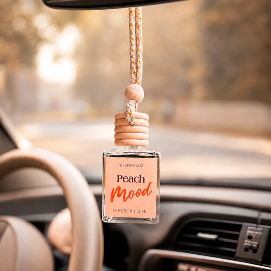 Difusor de Auto Eternaluz Peach Mood con aroma a durazno, naranja y vainilla.