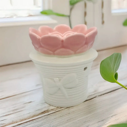 Difusor cerámico en forma de flor Eternaluz en tonos blanco y rosa, ideal para wax melts o aromaterapia