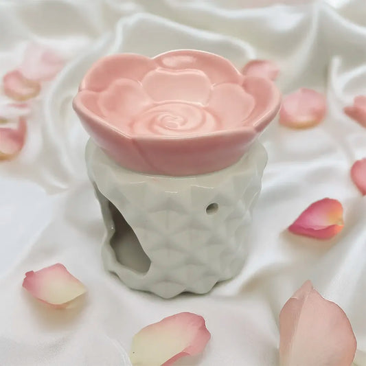 Difusor de cerámica con forma de rosa de Eternaluz en tonos blanco y rosado, ideal para wax melts o aromaterapia