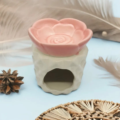 Difusor de cerámica con forma de rosa de Eternaluz en tonos blanco y rosado, ideal para wax melts o aromaterapia