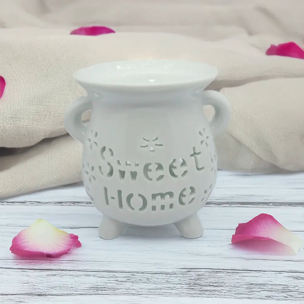 Difusor cerámico Sweet Home de Eternaluz en color blanco y negro con vela de té