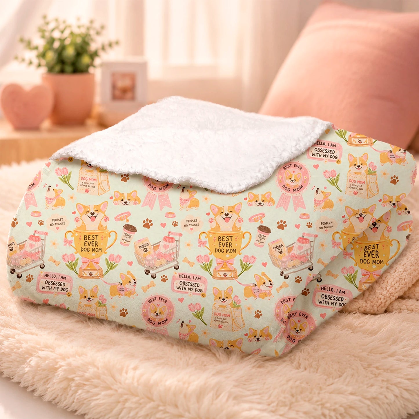 Manta de invierno para amantes de los perros con diseño de perritos, huellas, premios y detalles inspirados en mamás perrunas, confeccionada en felpa con reverso sherpa blanco.