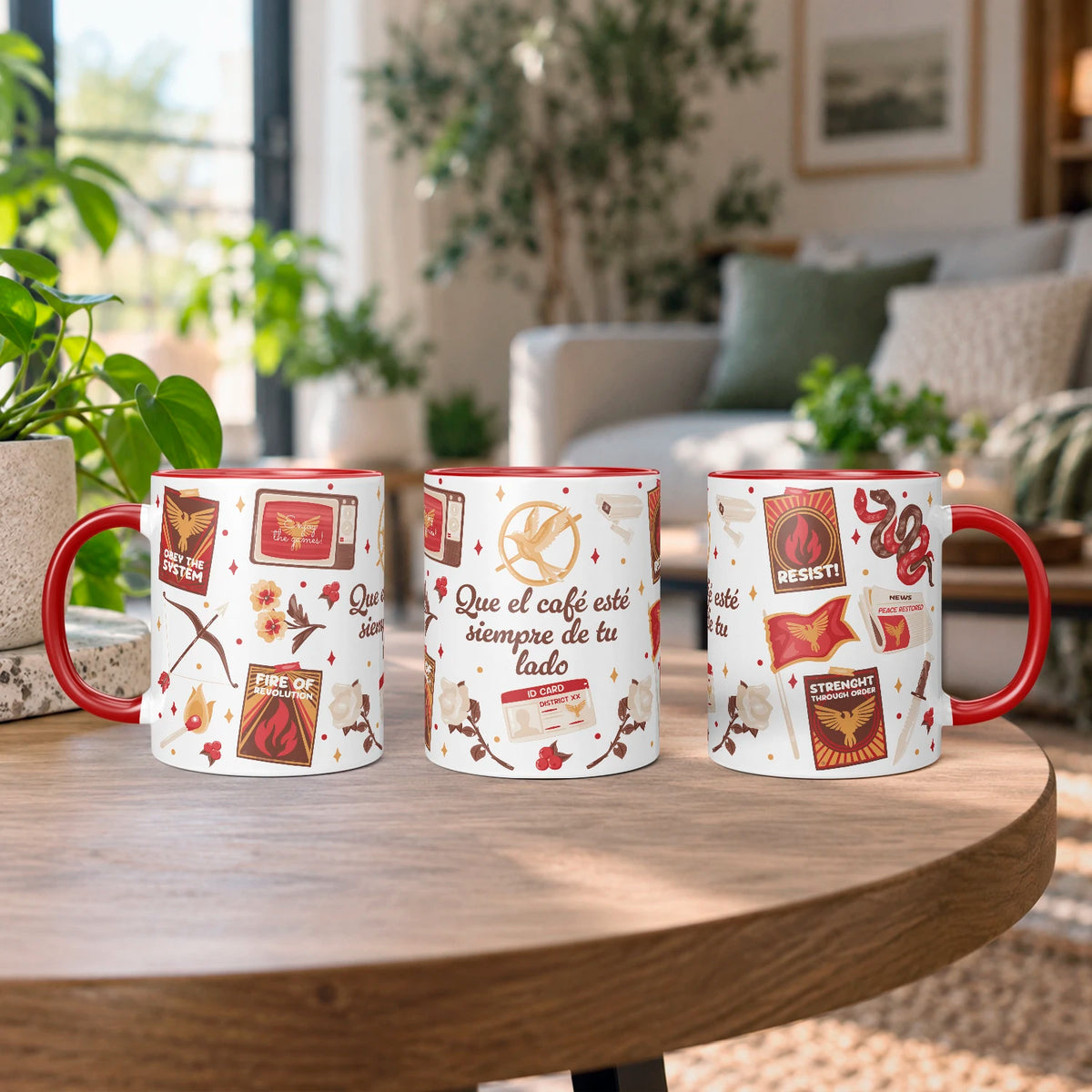 Taza sublimada de cerámica 11 oz Sinsajo, inspirada en Los Juegos del Hambre, con asa e interior rojo, arco, flecha, símbolos de rebelión y detalles rojos.